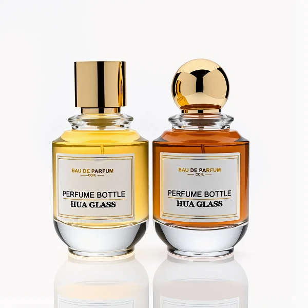 HUA0309 perfume bottle, rounded transparent colorless glass body with thick base and smooth curved silhouette, 100 ml liquid, glossy Zamac cap in cylindrical or spherical shape, printed label attached on bottle surface, elegant modern luxury design, ideal for gifting and daily use.