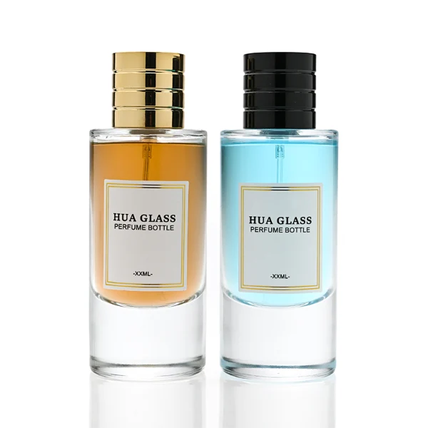 HUA0311 perfume bottle, cylindrical transparent colorless glass body with thick rounded base and smooth curved silhouette, 80 ml liquid, layered cylindrical plastic cap with ring groove details in gold or black finish, printed label attached on bottle surface, modern minimalist luxury design, ideal for gifting and daily use.