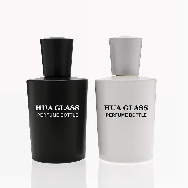 HUA0317 perfume bottle, cylindrical matte black, matte white, or transparent colorless glass body with thick rounded base, 50 ml or 70 ml liquid, flared cylindrical plastic cap in black, white, or gold finish, printed logo or brand label on bottle surface, modern minimalist fashion design, ideal for gifting and daily use.