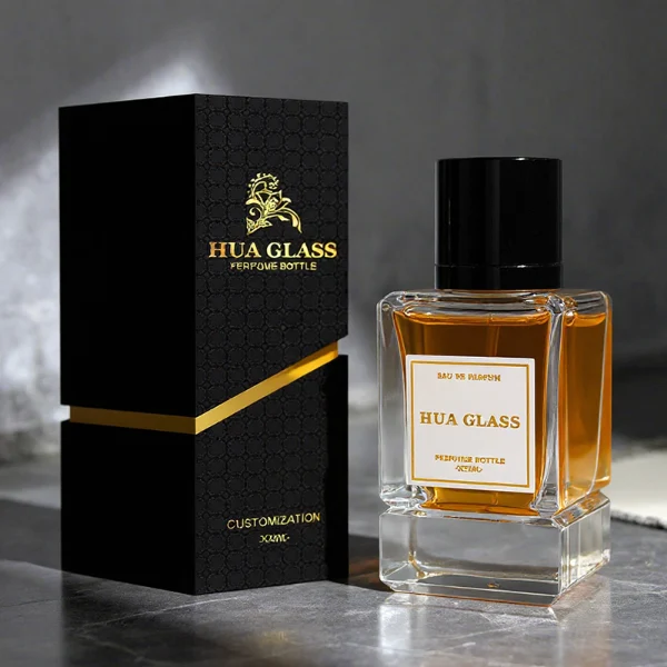 HUA0318 perfume bottle, rectangular transparent colorless glass body with thick base and sharp edges, 30 ml, 50 ml, or 100 ml liquid, glossy cylindrical aluminum cap in gold or black finish, printed label attached on bottle surface, modern minimalist luxury design, ideal for gifting and daily use.