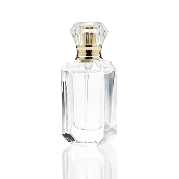 、HUA0319 perfume bottle, octahedral transparent glass body with diagonal faceted cutting and thick base, 10 ml, 30 ml, 50 ml, or 100 ml liquid, diamond-shaped plastic cap with gold or silver bottle neck, aluminum label/sticker attached on bottle surface, elegant modern luxury design, ideal for gifting and daily use.