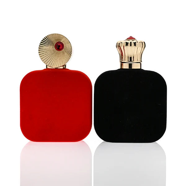 HUA0323 perfume bottle, rounded rectangular matte red or matte black glass body with thick base, 30 ml, 50 ml, or 100 ml liquid, decorative Zamac cap with engraved radial texture or crown-inspired design and jewel detail, aluminum label/sticker attached on bottle surface, artistic luxury vintage style, ideal for gifting and display.