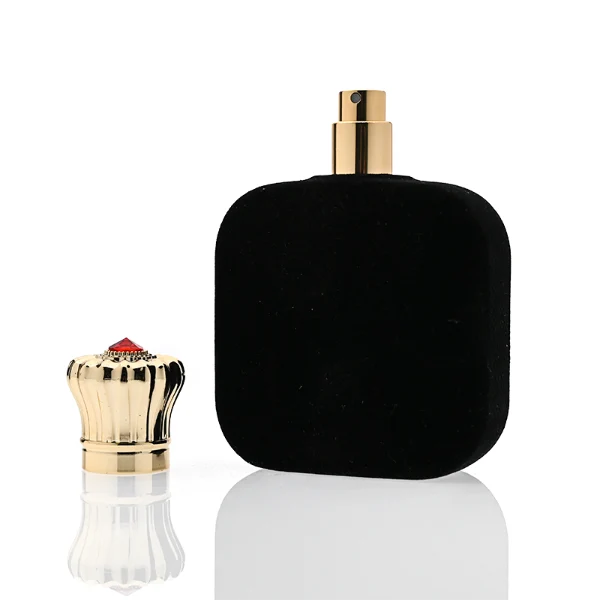 HUA0323 perfume bottle, rounded rectangular matte red or matte black glass body with thick base, 30 ml, 50 ml, or 100 ml liquid, decorative Zamac cap with engraved radial texture or crown-inspired design and jewel detail, aluminum label/sticker attached on bottle surface, artistic luxury vintage style, ideal for gifting and display.