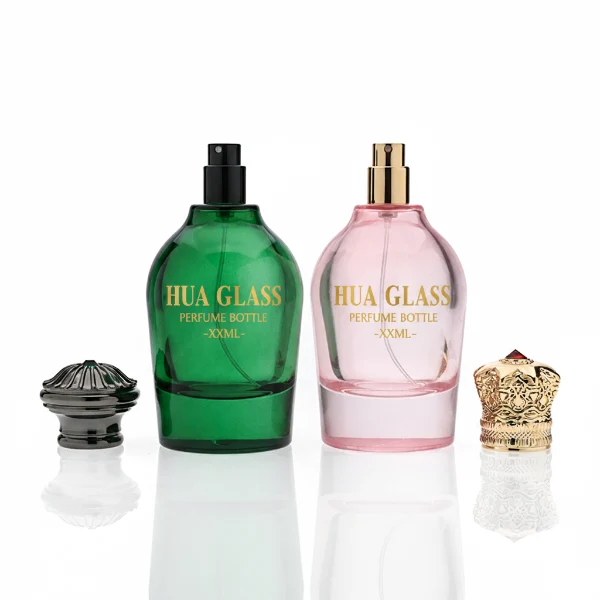 HUA0324 perfume bottle, rounded cylindrical semi-transparent red, blue, or smoky black glass body with thick base, 100 ml liquid, decorative Zamac cap with carved crown-inspired or layered dome design, metallic gold printed logo on bottle surface, vintage luxury artistic style, ideal for gifting and display.