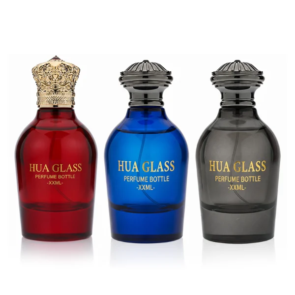 HUA0324 perfume bottle, rounded cylindrical semi-transparent red, blue, or smoky black glass body with thick base, 100 ml liquid, decorative Zamac cap with carved crown-inspired or layered dome design, metallic gold printed logo on bottle surface, vintage luxury artistic style, ideal for gifting and display.