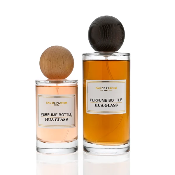 HUA0325 perfume bottle, cylindrical transparent colorless glass body with thick rounded base and smooth silhouette, 30 ml, 50 ml, 100 ml, 200 ml, or 250 ml liquid, spherical wooden cap with natural wood grain texture in light or dark finish, printed label attached on bottle surface, natural modern minimalist design, ideal for gifting and display.