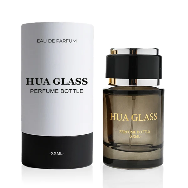 HUA0326 perfume bottle, rounded cylindrical semi-transparent smoky black, amber brown, or blue glass body with thick base, 30 ml, 50 ml, or 100 ml liquid, layered cylindrical plastic cap with black, white, or blue center section and glossy gold or silver accents on both ends, optional metallic gold printed logo or blank bottle surface, modern minimalist luxury design, ideal for gifting and daily use.