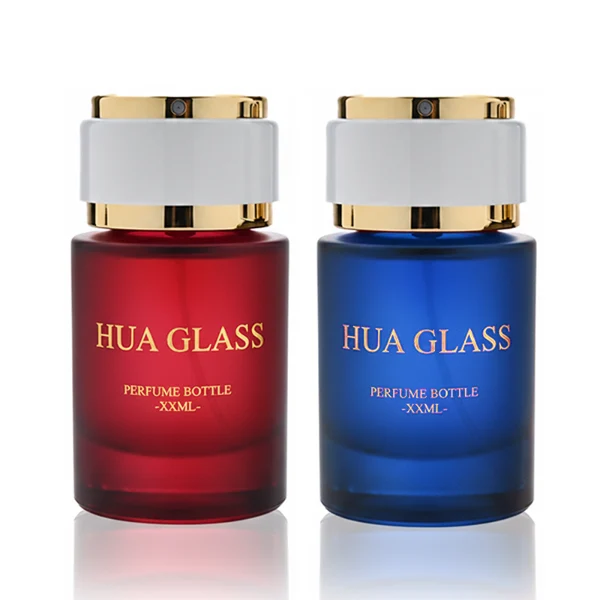 HUA0326 perfume bottle, rounded cylindrical semi-transparent smoky black, amber brown, or blue glass body with thick base, 30 ml, 50 ml, or 100 ml liquid, layered cylindrical plastic cap with black, white, or blue center section and glossy gold or silver accents on both ends, optional metallic gold printed logo or blank bottle surface, modern minimalist luxury design, ideal for gifting and daily use.