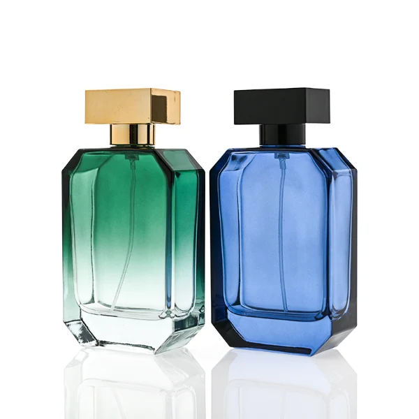 HUA0329 perfume bottle, multifaceted semi-transparent gradient green, blue, or red glass body with beveled polyhedral cutting and clear base, 30 ml, 50 ml, or 100 ml liquid, wide rectangular silver plastic cap with matching silver bottle neck, gold printed logo on bottle surface, modern geometric luxury design, ideal for gifting and daily use.