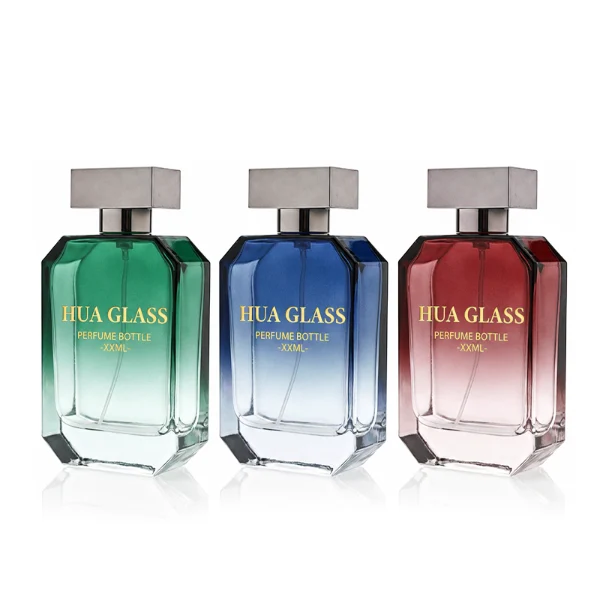 HUA0329 perfume bottle, multifaceted semi-transparent gradient green, blue, or red glass body with beveled polyhedral cutting and clear base, 30 ml, 50 ml, or 100 ml liquid, wide rectangular silver plastic cap with matching silver bottle neck, gold printed logo on bottle surface, modern geometric luxury design, ideal for gifting and daily use.