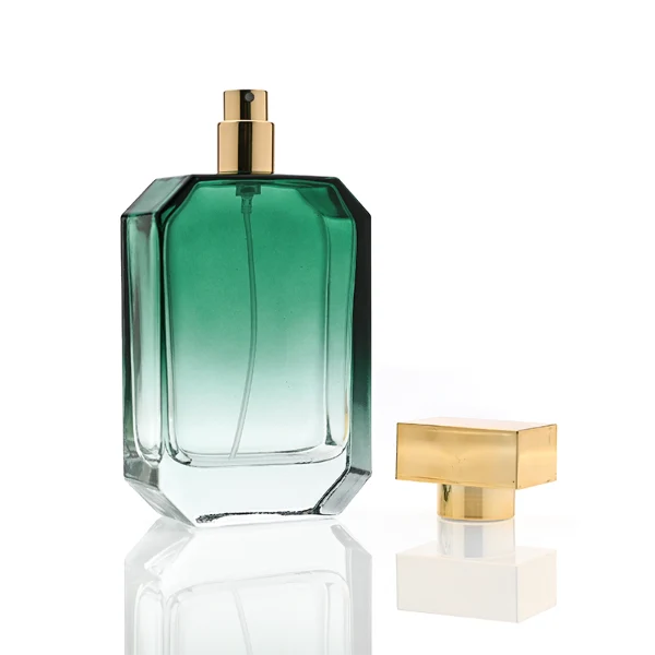 HUA0329 perfume bottle, multifaceted semi-transparent gradient green, blue, or red glass body with beveled polyhedral cutting and clear base, 30 ml, 50 ml, or 100 ml liquid, wide rectangular silver plastic cap with matching silver bottle neck, gold printed logo on bottle surface, modern geometric luxury design, ideal for gifting and daily use.
