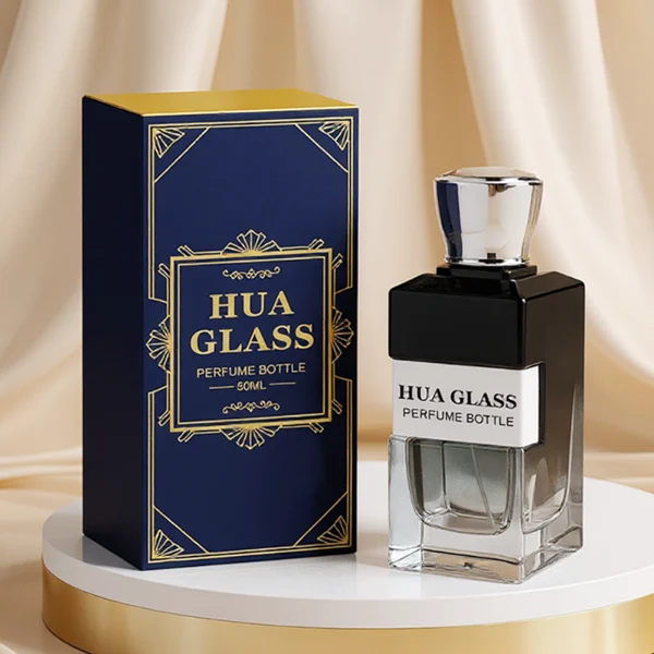 HUA0332 perfume bottle, rectangular semi-transparent gradient black or transparent colorless glass body with smooth curved edges and thick base, 100 ml liquid, rounded square-shaped glossy plastic cap in gold or silver finish, brand logo label attached on bottle surface, modern geometric luxury design, ideal for gifting and daily use.
