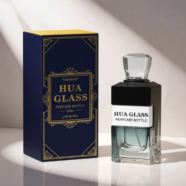 HUA0332 perfume bottle, rectangular semi-transparent gradient black or transparent colorless glass body with smooth curved edges and thick base, 100 ml liquid, rounded square-shaped glossy plastic cap in gold or silver finish, brand logo label attached on bottle surface, modern geometric luxury design, ideal for gifting and daily use.