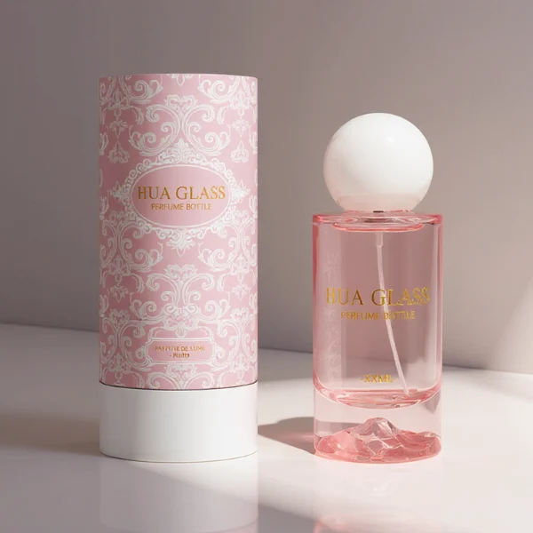 HUA0333 perfume bottle, rounded cylindrical frosted glass body in white, pink, lavender, or light blue, 30 ml, 50 ml, or 100 ml liquid, spherical resin cap with marble-inspired texture, silver bottle neck, gold printed brand logo on bottle surface, modern pastel luxury design, ideal for gifting and daily use.