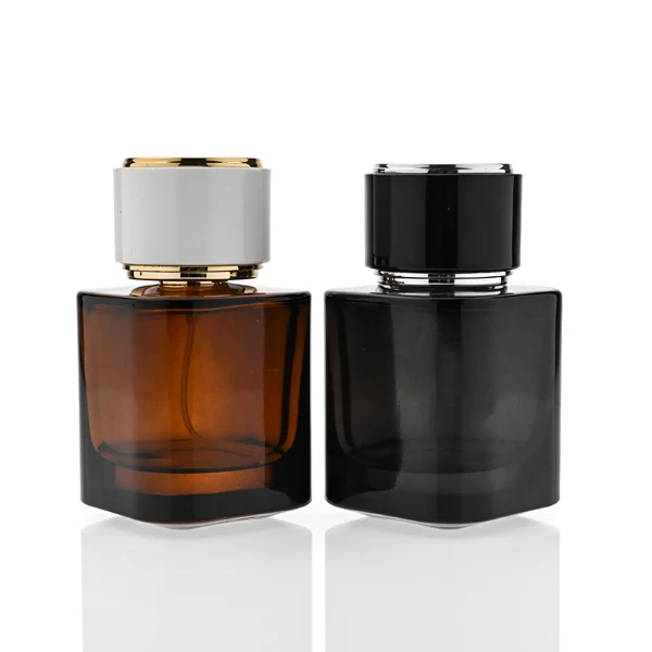 HUA0335 perfume bottle, cylindrical semi-transparent red, blue, or green glass body with thick base, 30 ml, 50 ml, or 100 ml liquid, cylindrical plastic cap with flat top and metal decorative rings on both ends, gold bottle neck, gold printed brand logo on bottle surface, modern minimalist luxury design, ideal for gifting and daily use.