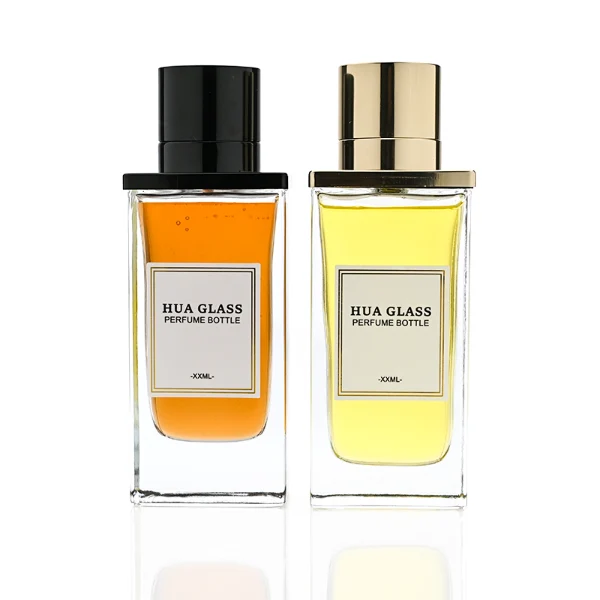 HUA0336 perfume bottle, rectangular transparent colorless glass body with thick base, 100 ml liquid, T-shaped aluminum and magnetic cap with cylindrical upper structure and horizontal flat top in black or gold finish, label attached on bottle surface, modern minimalist luxury design, ideal for gifting and daily use.