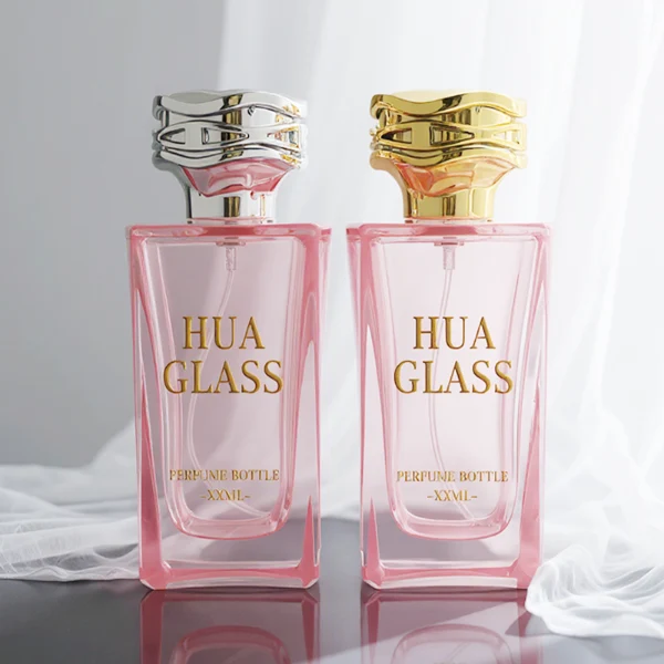 HUA0338 perfume bottle, rectangular transparent pink glass body with curved inner contour and thick base, 100 ml liquid, irregular geometric plastic cap with wave-pattern side texture in gold or silver finish, matching metallic bottle neck, clean bottle surface for logo printing or label application, elegant feminine luxury design, ideal for gifting and daily use.