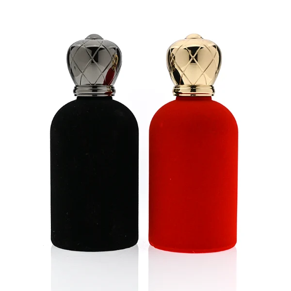 HUA0340 perfume bottle, rounded cylindrical glossy black or red glass body covered in velvet with thick base, 30 ml, 50 ml, or 100 ml liquid, crown-shaped Zamak cap with faceted rhombus-cut pattern in matching glossy black or red, black or gold bottle neck matching cap, gold printed brand logo on velvet surface, modern royal luxury design, ideal for gifting and daily use.