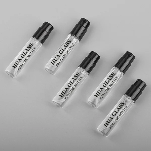 HUA0195 perfume bottle, small cylindrical transparent glass body with 1.5 ml, 2 ml, 3 ml, or 5 ml liquid, black or white plastic spray cap, printed logo, compact and practical design, ideal for travel and sample use.