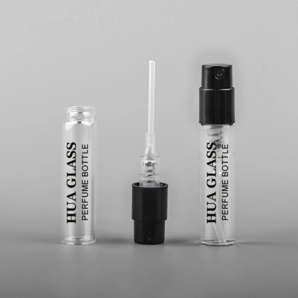 HUA0195 perfume bottle, small cylindrical transparent glass body with 1.5 ml, 2 ml, 3 ml, or 5 ml liquid, black or white plastic spray cap, printed logo, compact and practical design, ideal for travel and sample use.
