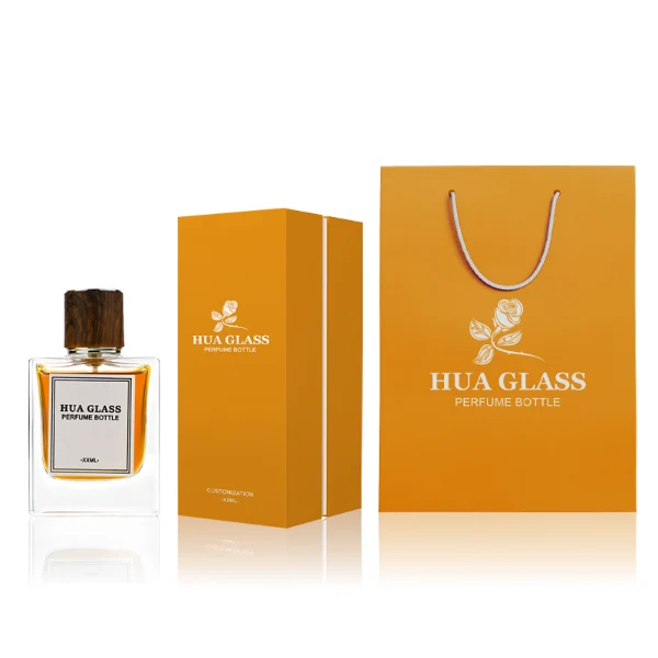 HUA0260 perfume bottle, rectangular transparent glass body with clean straight edges and thick base, 50 ml or 100 ml liquid, cylindrical wood-grain plastic cap with smooth surface and silver bottle neck, printed logo label, modern minimalist luxury design, ideal for gifting and daily use.