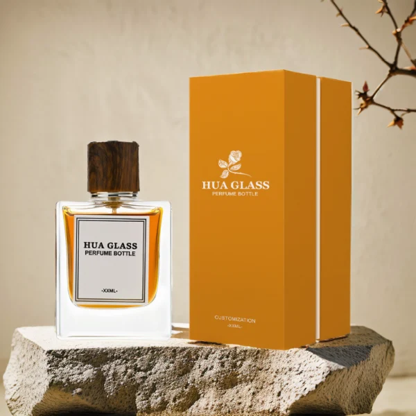 HUA0260 perfume bottle, rectangular transparent glass body with clean straight edges and thick base, 50 ml or 100 ml liquid, cylindrical wood-grain plastic cap with smooth surface and silver bottle neck, printed logo label, modern minimalist luxury design, ideal for gifting and daily use.