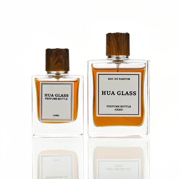 HUA0260 perfume bottle, rectangular transparent glass body with clean straight edges and thick base, 50 ml or 100 ml liquid, cylindrical wood-grain plastic cap with smooth surface and silver bottle neck, printed logo label, modern minimalist luxury design, ideal for gifting and daily use.