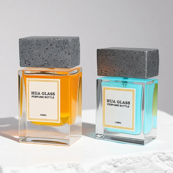 HUA0341 perfume bottle, rectangular transparent colorless glass body with thick base and curved inner contour, 50 ml liquid, oversized rectangular artificial stone cap with matte textured surface, no bottle neck, brand logo label attached on bottle surface, modern architectural luxury design, ideal for gifting and daily use.