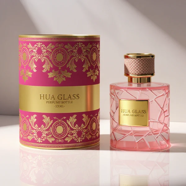HUA0342 perfume bottle, cylindrical transparent pink glass body with fragmented surface texture, 50 ml or 100 ml liquid, gold plastic cap with textured pink or black side surface and glossy gold top, gold bottle neck, aluminum brand label attached on bottle surface, modern feminine luxury design, ideal for gifting and daily use.