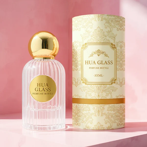 HUA0345 perfume bottle, cylindrical transparent colorless glass body with vertical ribbed texture, 50 ml or 100 ml liquid, spherical glossy gold plastic cap with magnetic closure, gold bottle neck, gold aluminum label attached on bottle surface, elegant luxury design, ideal for gifting and daily use.