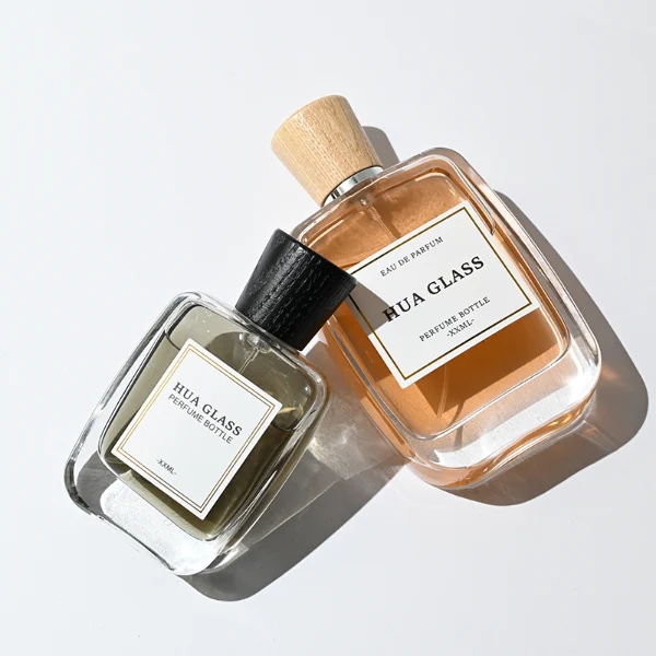 HUA0348 perfume bottle, rounded rectangular clear glass body with thick base, tapered wooden cap available in black, brown, or natural wood color, optional gold or silver collar, modern minimalist luxury fragrance packaging design