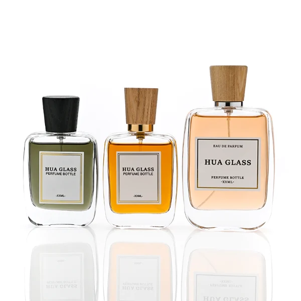HUA0348 perfume bottle, rounded rectangular clear glass body with thick base, tapered wooden cap available in black, brown, or natural wood color, optional gold or silver collar, modern minimalist luxury fragrance packaging design