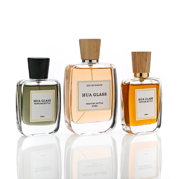 HUA0348 perfume bottle, rounded rectangular clear glass body with thick base, tapered wooden cap available in black, brown, or natural wood color, optional gold or silver collar, modern minimalist luxury fragrance packaging design