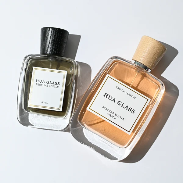 HUA0348 perfume bottle, rounded rectangular clear glass body with thick base, tapered wooden cap available in black, brown, or natural wood color, optional gold or silver collar, modern minimalist luxury fragrance packaging design
