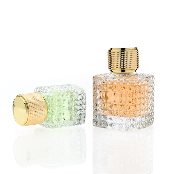 HUA0349 perfume bottle, embossed round clear glass body with aluminum label plate, layered ring edge details, textured metallic cylindrical cap, luxury vintage fragrance packaging design
