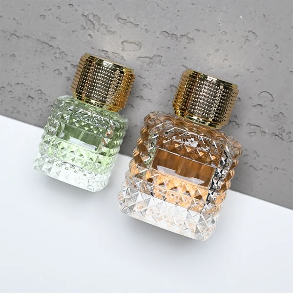 HUA0349 perfume bottle, embossed round clear glass body with aluminum label plate, layered ring edge details, textured metallic cylindrical cap, luxury vintage fragrance packaging design