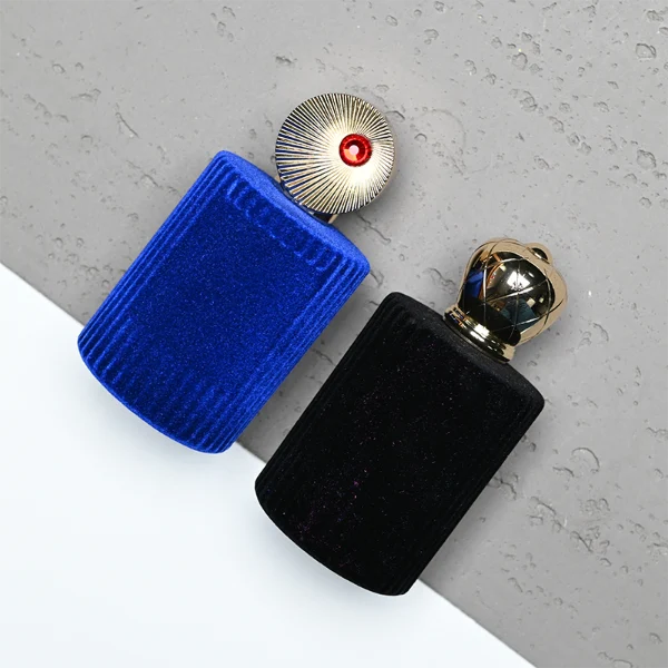 HUA0351 perfume bottle, velvet wrapped cylindrical glass body with gold aluminum label plate, decorative metallic zamak cap with sunburst texture or irregular cylindrical shape, luxury artistic vintage fragrance packaging design