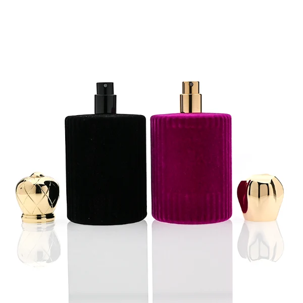 HUA0351 perfume bottle, velvet wrapped cylindrical glass body with gold aluminum label plate, decorative metallic zamak cap with sunburst texture or irregular cylindrical shape, luxury artistic vintage fragrance packaging design