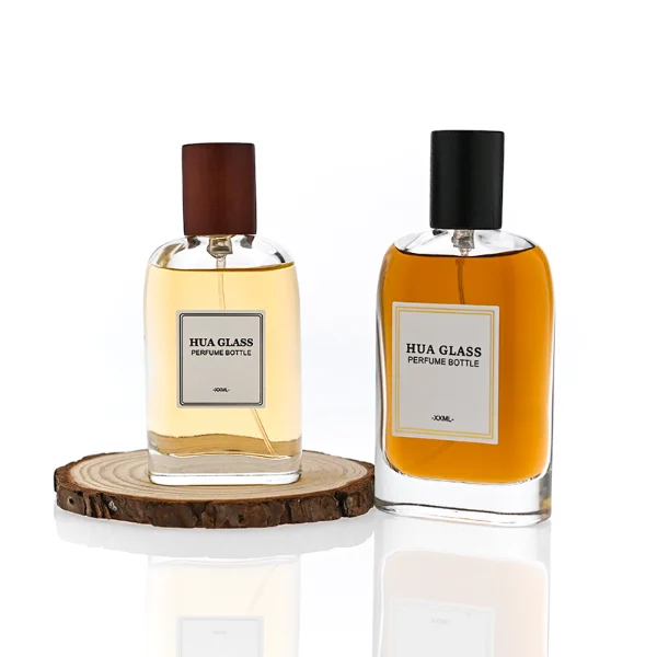 HUA0353 perfume bottle, flat cylindrical glass body with reddish-brown or black cylindrical wooden cap, square paper label with minimalist border, Nordic minimalist fragrance packaging design available in 50ml and 75ml