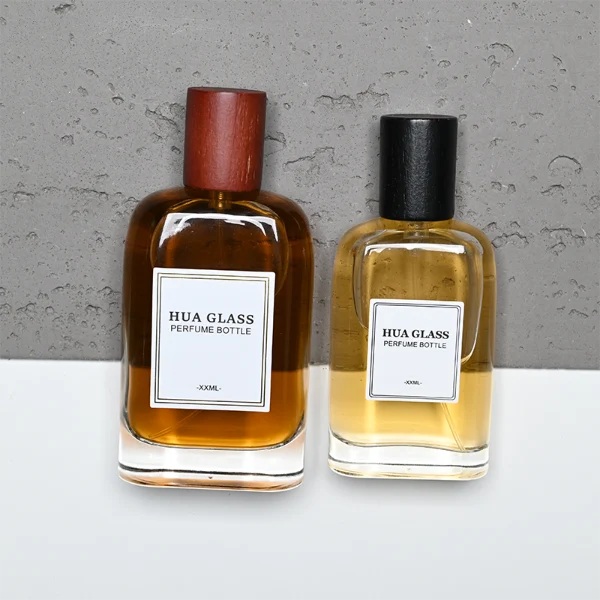 HUA0353 perfume bottle, flat cylindrical glass body with reddish-brown or black cylindrical wooden cap, square paper label with minimalist border, Nordic minimalist fragrance packaging design available in 50ml and 75ml