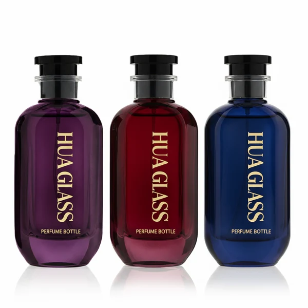 HUA0354 perfume bottle, cylindrical glass body in black, green, and blue with vertical gold printed logo, black plastic cap with a transparent accent ring, modern bold luxury fragrance packaging design available in 50ml and 100ml