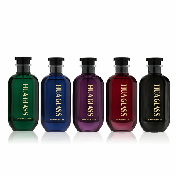 HUA0354 perfume bottle, cylindrical glass body in black, green, and blue with vertical gold printed logo, black plastic cap with a transparent accent ring, modern bold luxury fragrance packaging design available in 50ml and 100ml