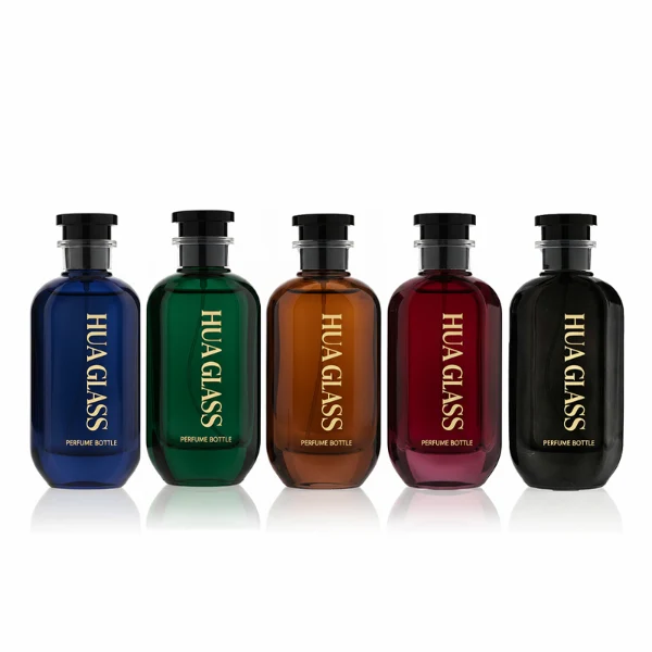 HUA0354 perfume bottle, cylindrical glass body in black, green, and blue with vertical gold printed logo, black plastic cap with a transparent accent ring, modern bold luxury fragrance packaging design available in 50ml and 100ml