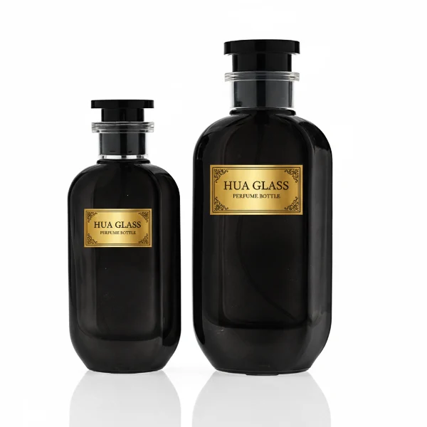 HUA0354 perfume bottle, cylindrical glass body in black, green, and blue with vertical gold printed logo, black plastic cap with a transparent accent ring, modern bold luxury fragrance packaging design available in 50ml and 100ml