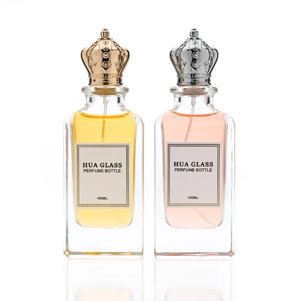 HUA0356 perfume bottle, rectangular cuboid clear glass body with ornate engraved gold or silver royal crown cap, centered paper label with elegant border, luxury imperial vintage fragrance packaging design