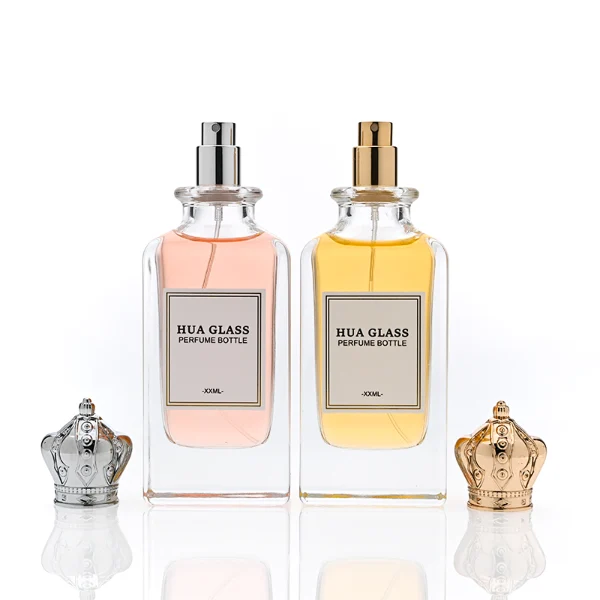 HUA0356 perfume bottle, rectangular cuboid clear glass body with ornate engraved gold or silver royal crown cap, centered paper label with elegant border, luxury imperial vintage fragrance packaging design