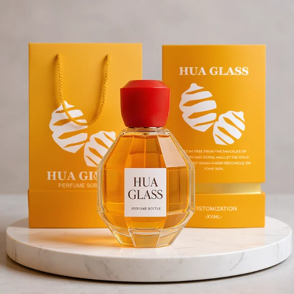 HUA0357 perfume bottle, multi-faceted geometric cut spherical clear glass body with orange-red or yellow marble-textured resin cap, centered square minimalist paper label, contemporary artistic luxury fragrance packaging design