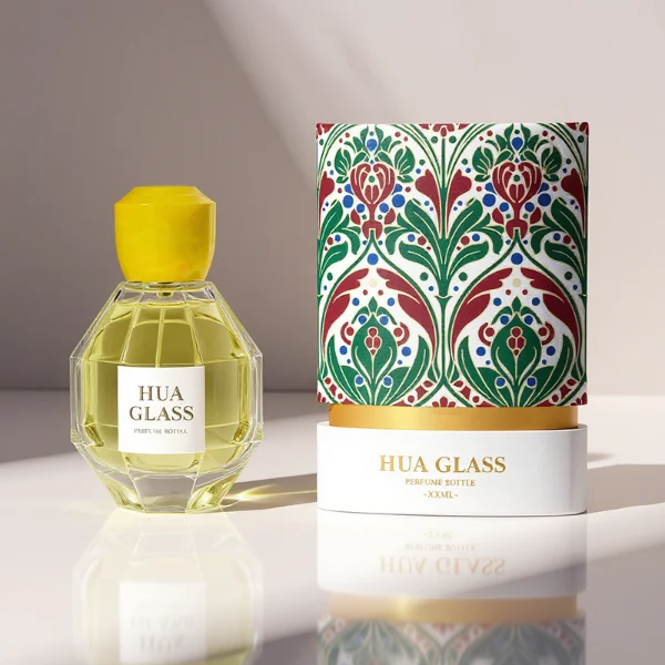 HUA0357 perfume bottle, multi-faceted geometric cut spherical clear glass body with orange-red or yellow marble-textured resin cap, centered square minimalist paper label, contemporary artistic luxury fragrance packaging design