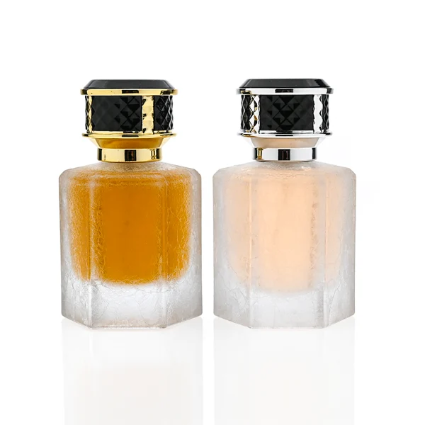HUA0358 perfume bottle, hexahedral column glass body in translucent blue, pink, and purple with gold neck and gold printed logo, black mesh-textured plastic cap, chic contemporary fragrance packaging design available in 50ml and 100ml