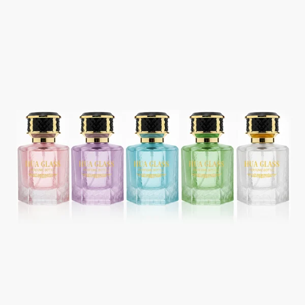 HUA0358 perfume bottle, hexahedral column glass body in translucent blue, pink, and purple with gold neck and gold printed logo, black mesh-textured plastic cap, chic contemporary fragrance packaging design available in 50ml and 100ml